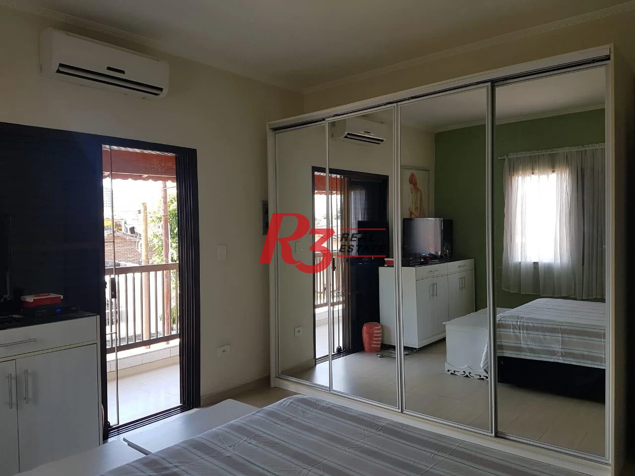 Sobrado com 3 dormitórios à venda, 124 m² por R$ 930.000,00 - Mirim - Praia Grande/SP