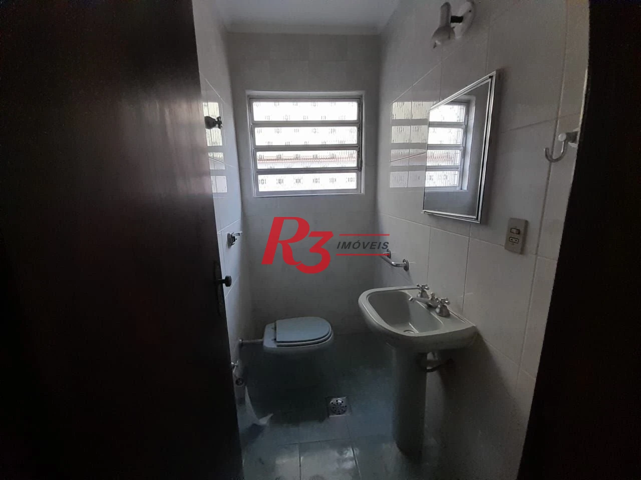 Casa com 3 dormitórios à venda, 250 m² por R$ 1.600.000,00 - Gonzaga - Santos/SP