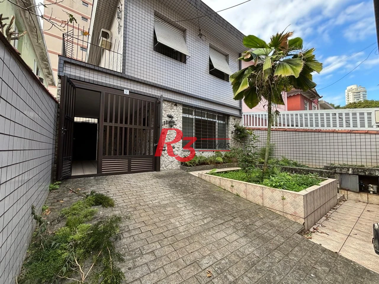 Casa com 3 dormitórios à venda, 250 m² por R$ 1.600.000,00 - Gonzaga - Santos/SP