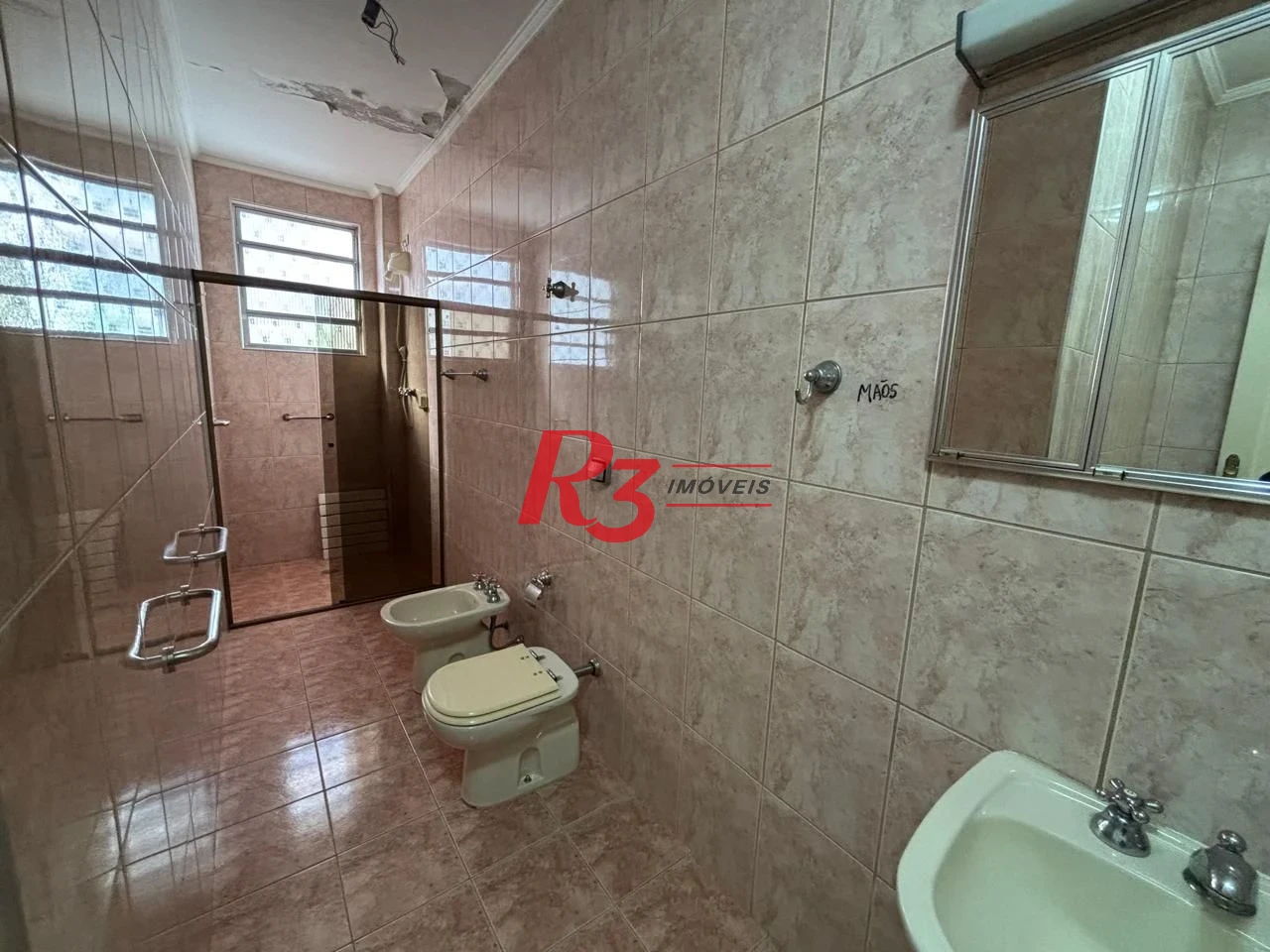 Casa com 3 dormitórios à venda, 250 m² por R$ 1.600.000,00 - Gonzaga - Santos/SP