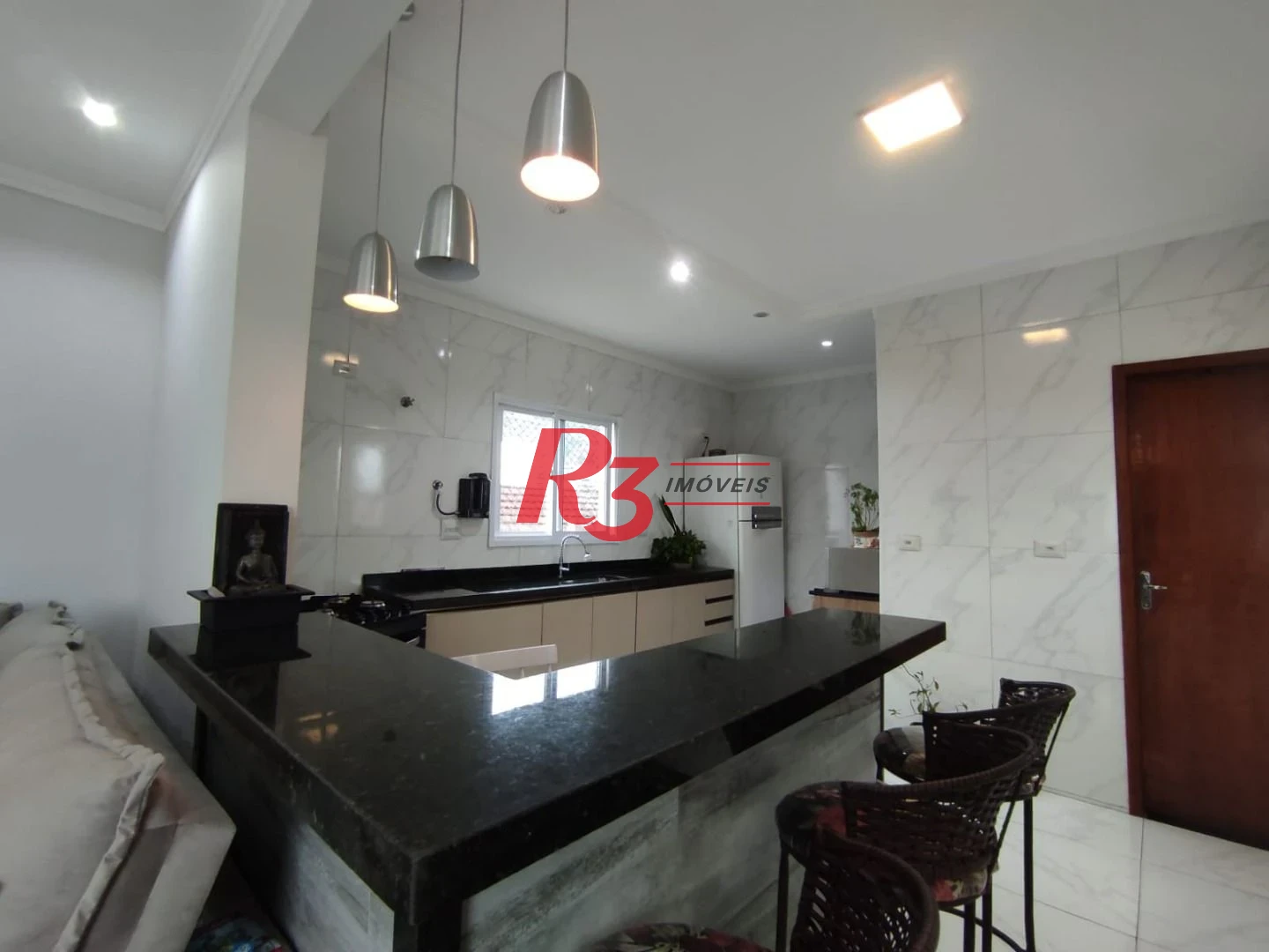 Casa à venda, 145 m² por R$ 620.000,00 - Vila Voturuá - São Vicente/SP