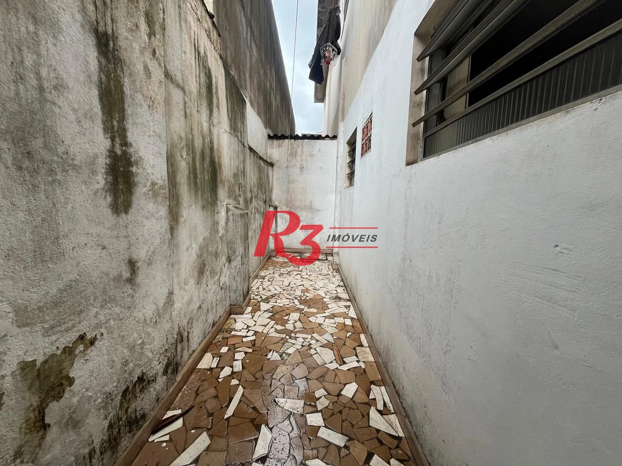 Sobrado com 3 dormitórios à venda, 115 m² por R$ 600.000,00 - Ponta da Praia - Santos/SP