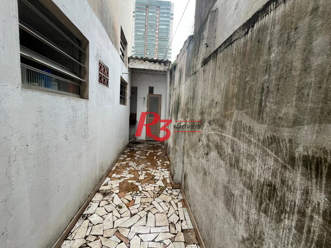 Sobrado com 3 dormitórios à venda, 115 m² por R$ 600.000,00 - Ponta da Praia - Santos/SP