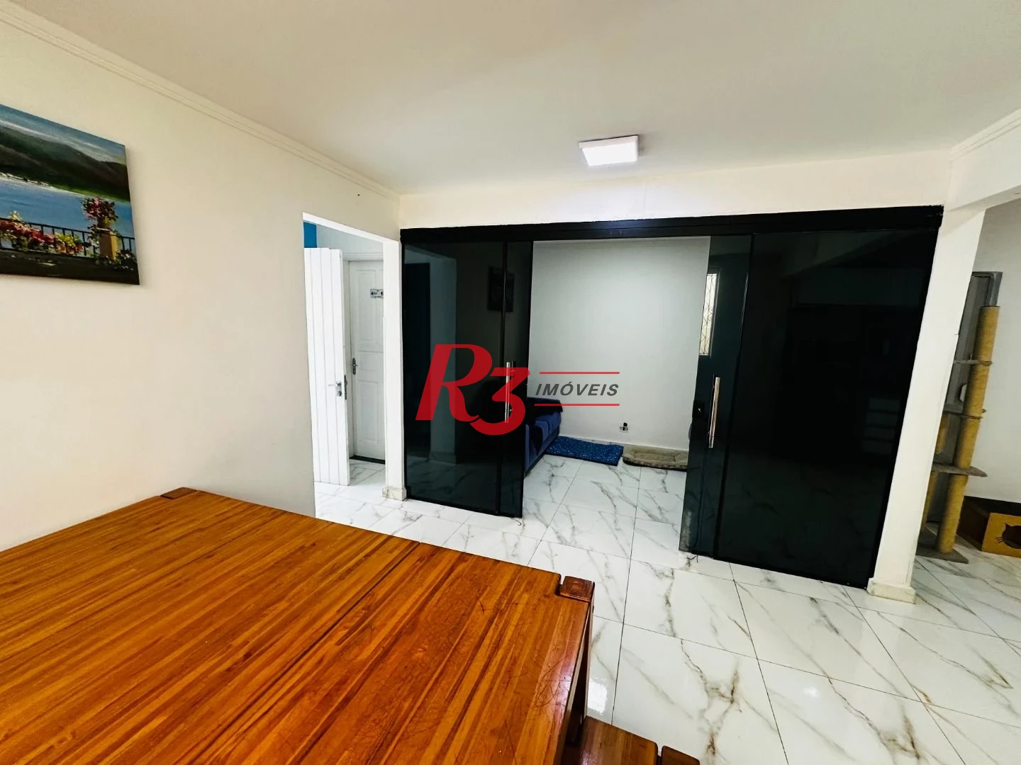 Sobrado com 4 dormitórios à venda, 245 m² por R$ 1.500.000,00 - Ponta da Praia - Santos/SP