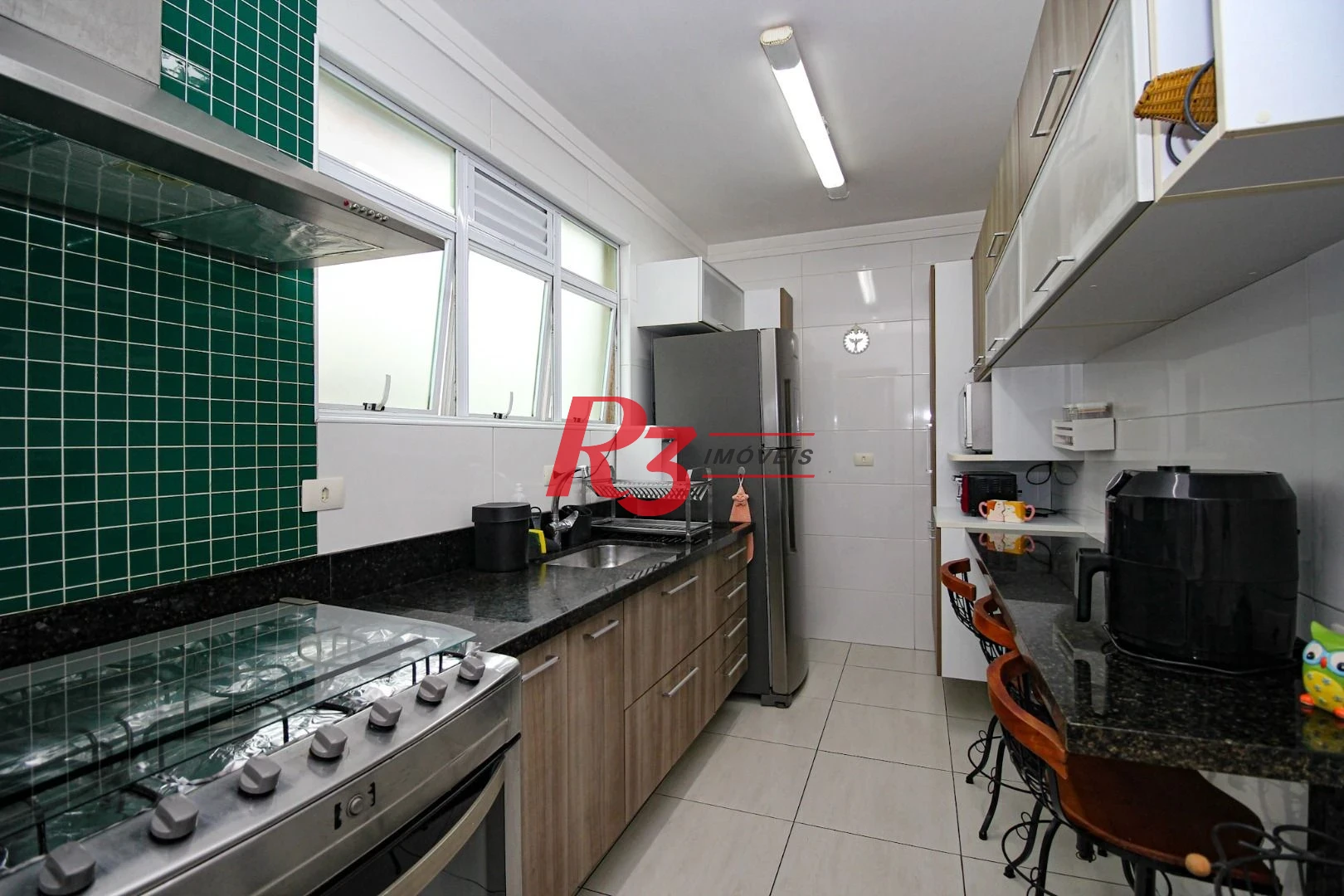 Casa com 3 dormitórios à venda, 136 m² por R$ 1.150.000,00 - Gonzaga - Santos/SP