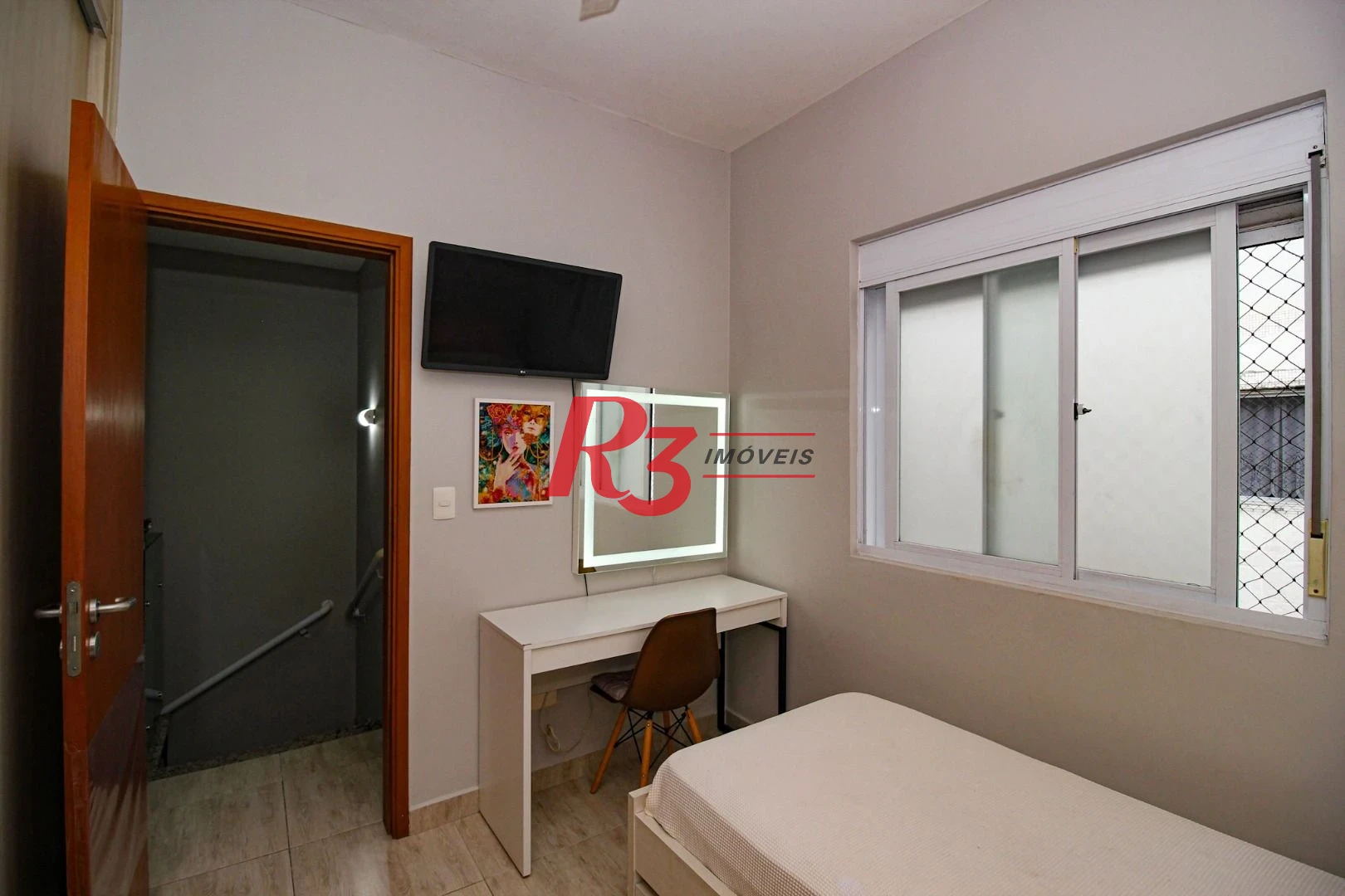 Casa com 3 dormitórios à venda, 136 m² por R$ 1.150.000,00 - Gonzaga - Santos/SP