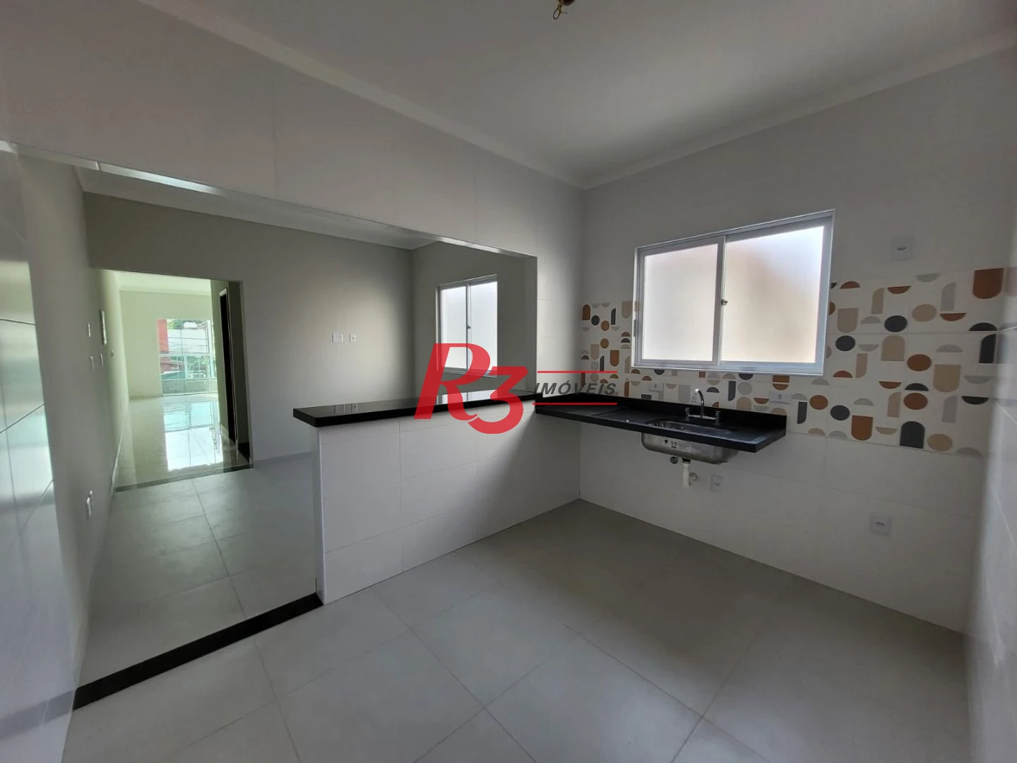 Casa com 3 dormitórios à venda, 134 m² por R$ 945.000,00 - Aparecida - Santos/SP