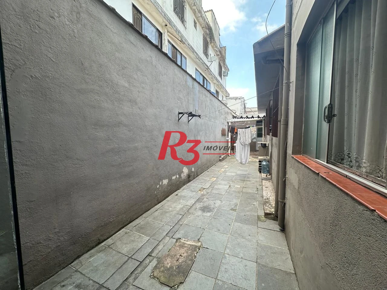 Casa com 6 dormitórios à venda, 223 m² por R$ 900.000,00 - Vila Matias - Santos/SP