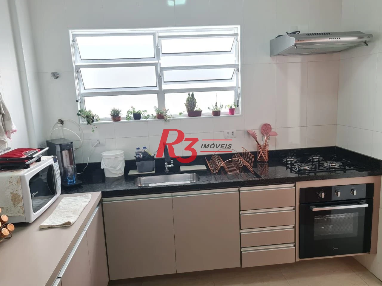 Casa com 3 dormitórios à venda, 146 m² por R$ 1.080.000,00 - Embaré - Santos/SP