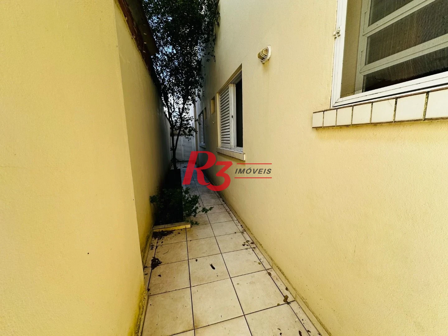 Casa com 3 dormitórios à venda, 120 m² por R$ 1.100.000,00 - Ponta da Praia - Santos/SP