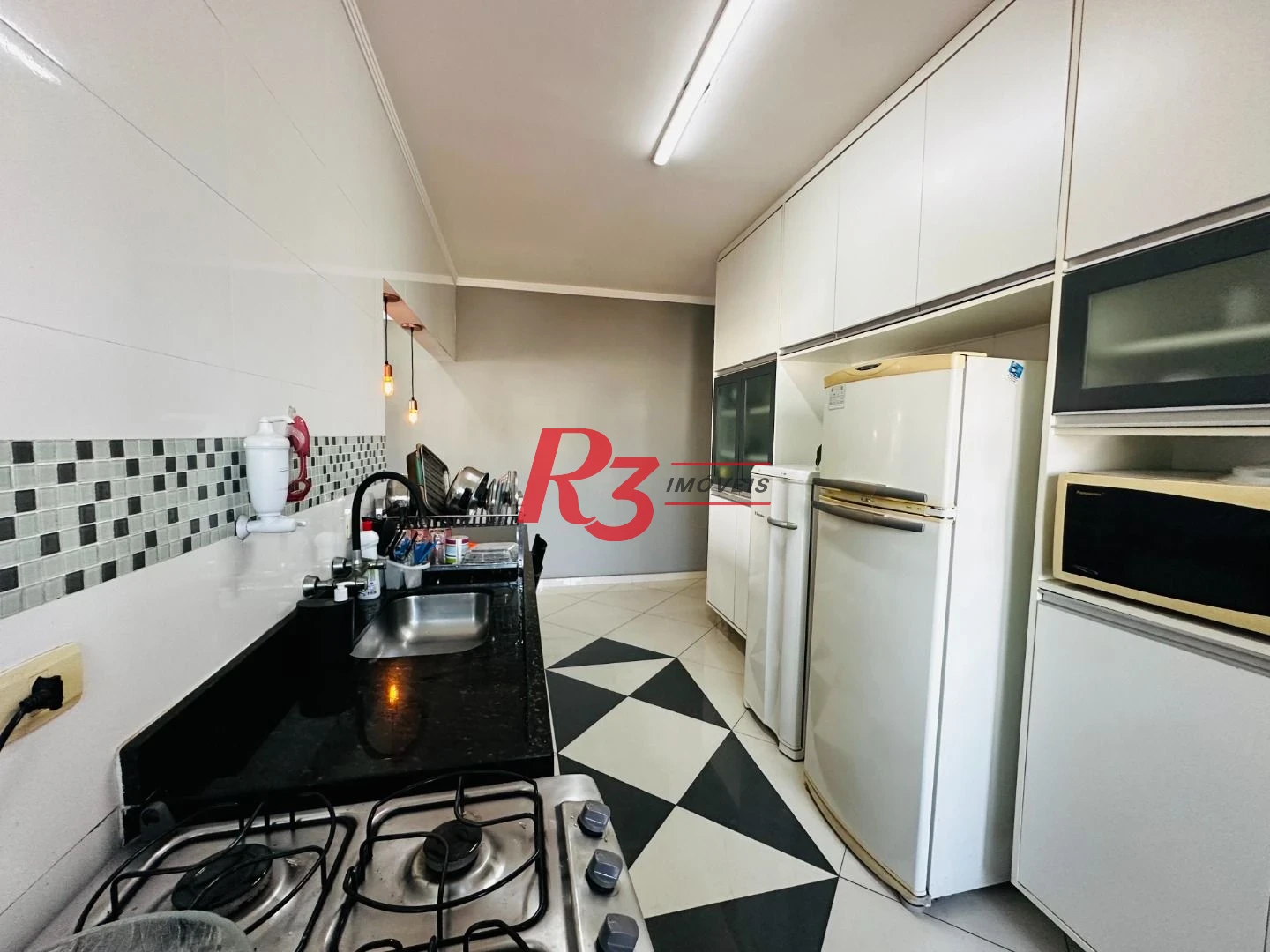 Casa com 3 dormitórios à venda, 210 m² por R$ 650.000,00 - Centro - São Vicente/SP
