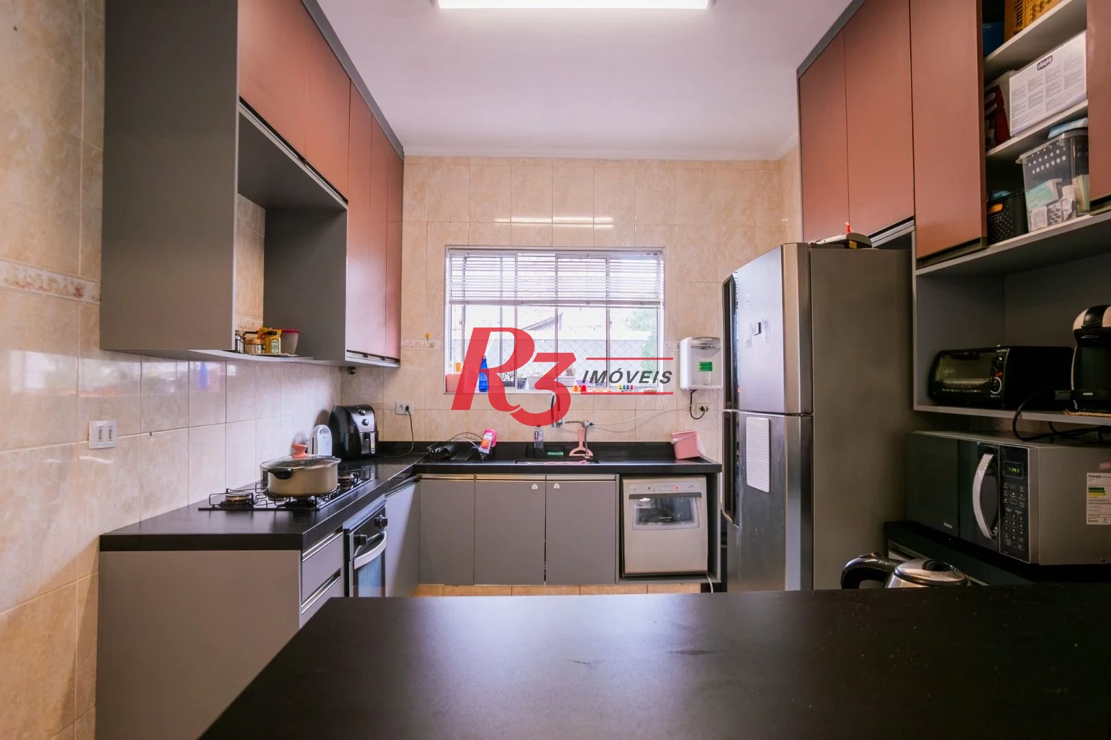 Casa com 3 dormitórios à venda, 320 m² por R$ 1.790.000,00 - Gonzaga - Santos/SP