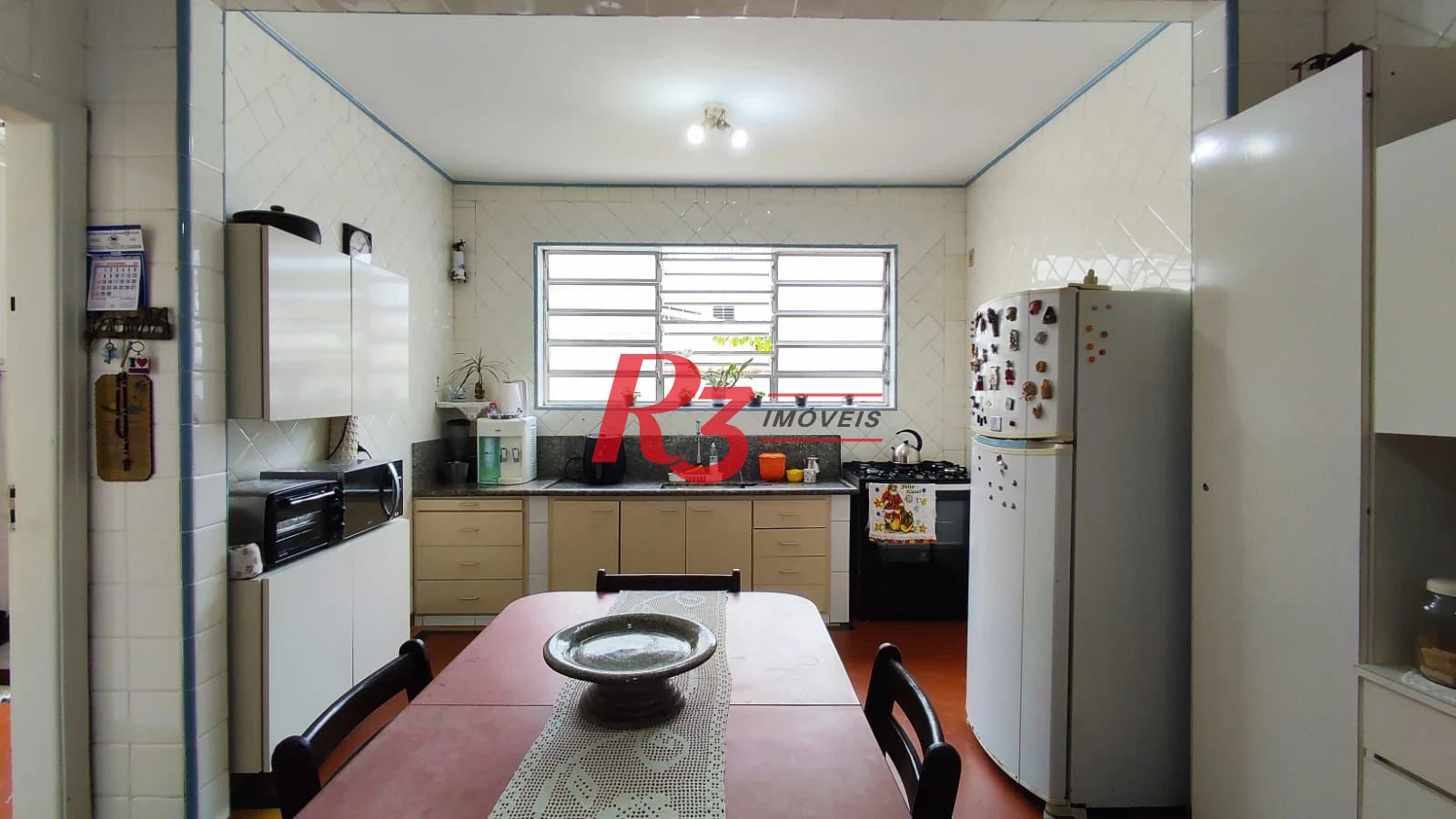 Sobrado com 4 dormitórios à venda, 222 m² por R$ 2.200.000,00 - Ponta da Praia - Santos/SP