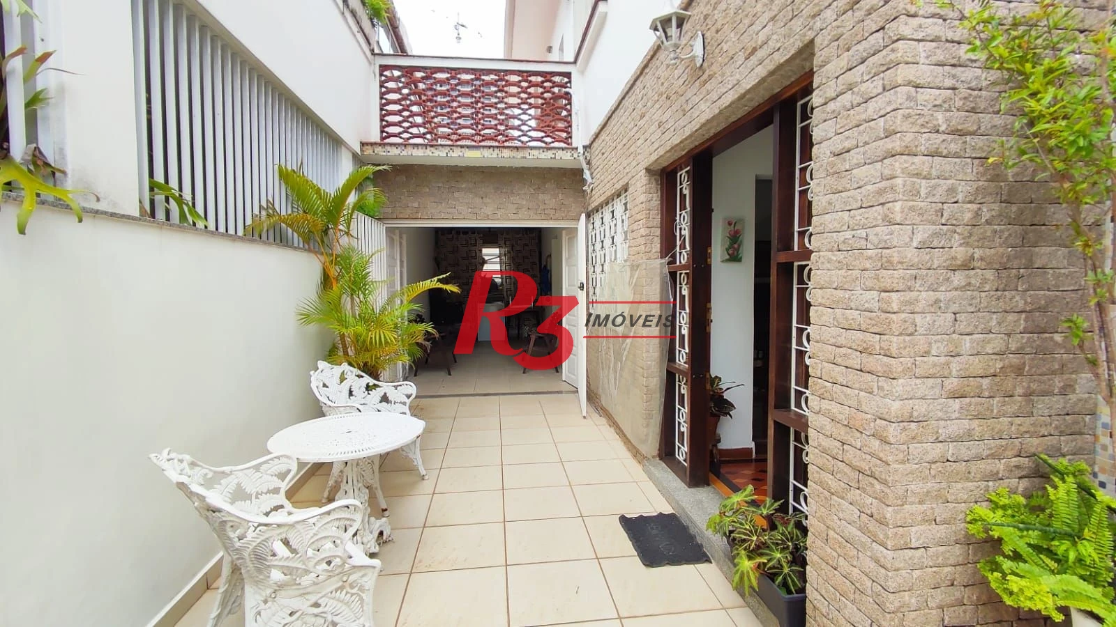 Sobrado com 4 dormitórios à venda, 222 m² por R$ 2.200.000,00 - Ponta da Praia - Santos/SP