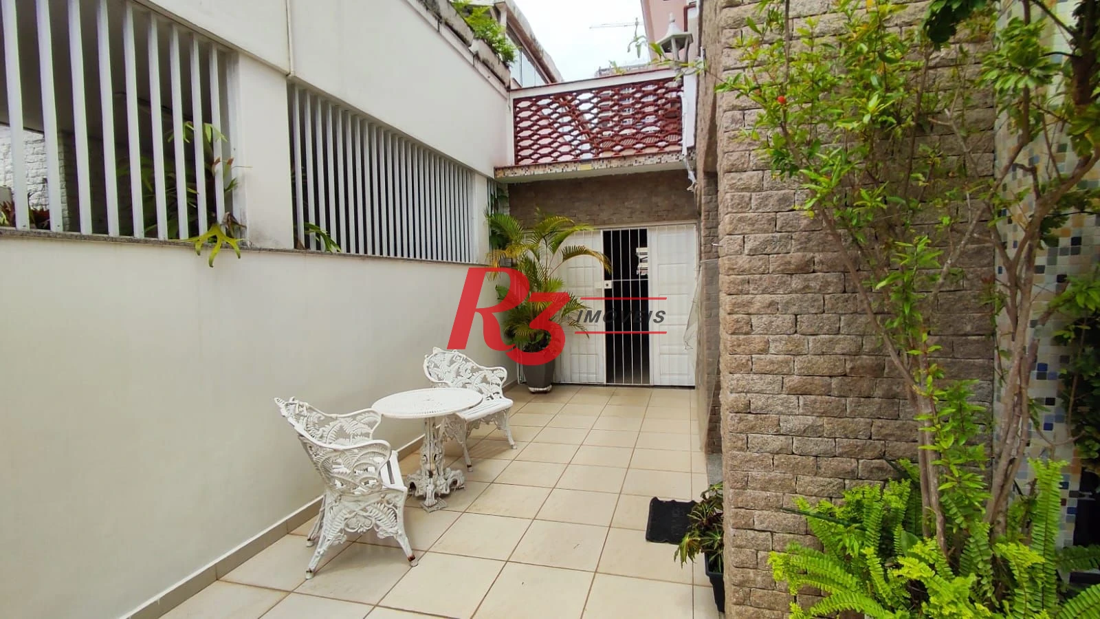 Sobrado com 4 dormitórios à venda, 222 m² por R$ 2.200.000,00 - Ponta da Praia - Santos/SP