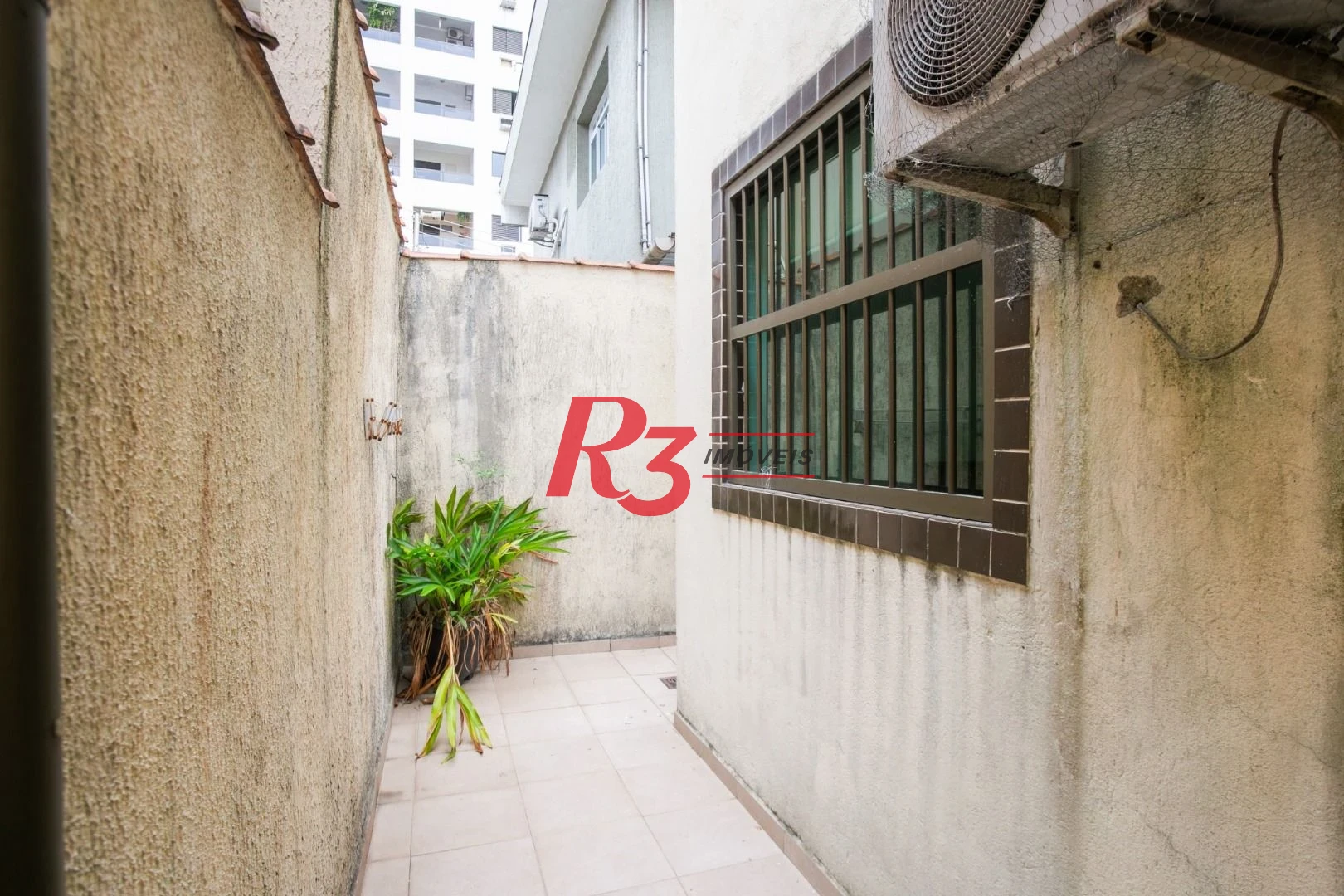 Sobrado com 3 dormitórios à venda, 92 m² por R$ 800.000,00 - Ponta da Praia - Santos/SP
