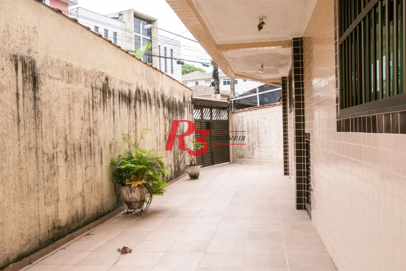 Sobrado com 3 dormitórios à venda, 92 m² por R$ 800.000,00 - Ponta da Praia - Santos/SP