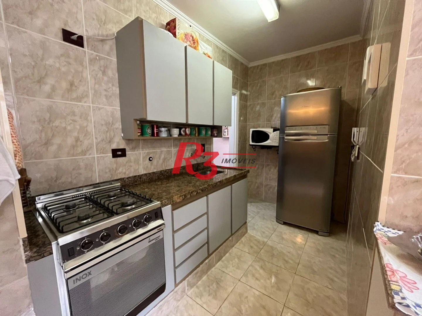 Apartamento com 3 dormitórios à venda, 82 m² por R$ 500.000,00 - Jardim Tejereba - Guarujá/SP
