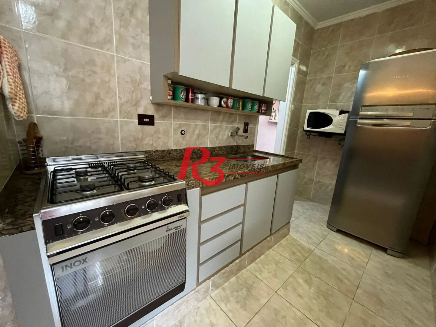 Apartamento com 3 dormitórios à venda, 82 m² por R$ 500.000,00 - Jardim Tejereba - Guarujá/SP