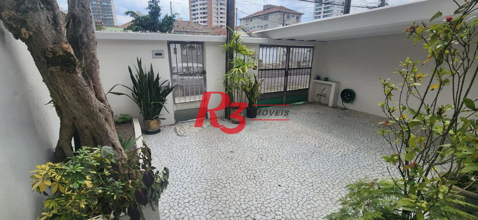 Casa com 3 dormitórios à venda, 117 m² por R$ 790.000,00 - Aparecida - Santos/SP