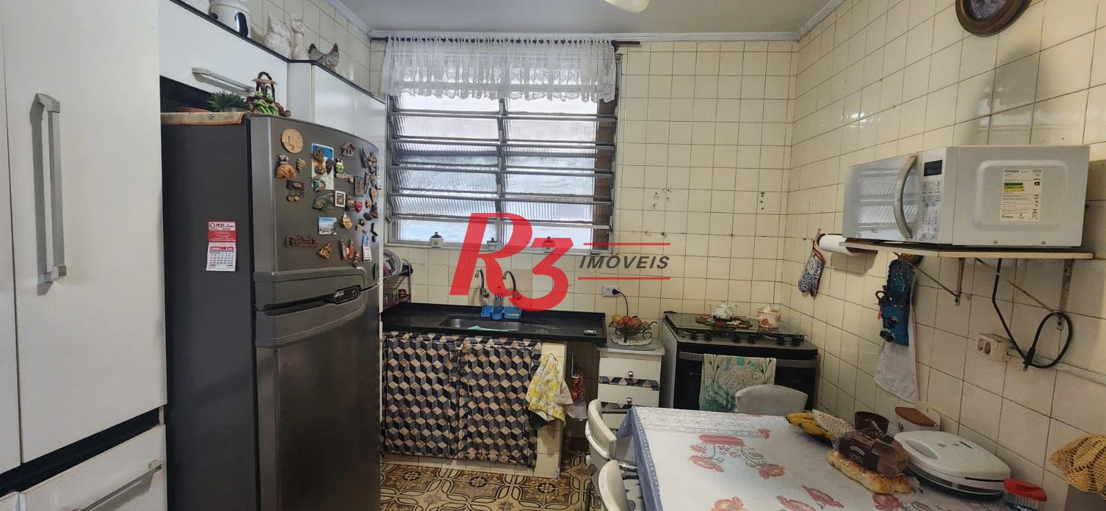 Casa com 3 dormitórios à venda, 117 m² por R$ 790.000,00 - Aparecida - Santos/SP