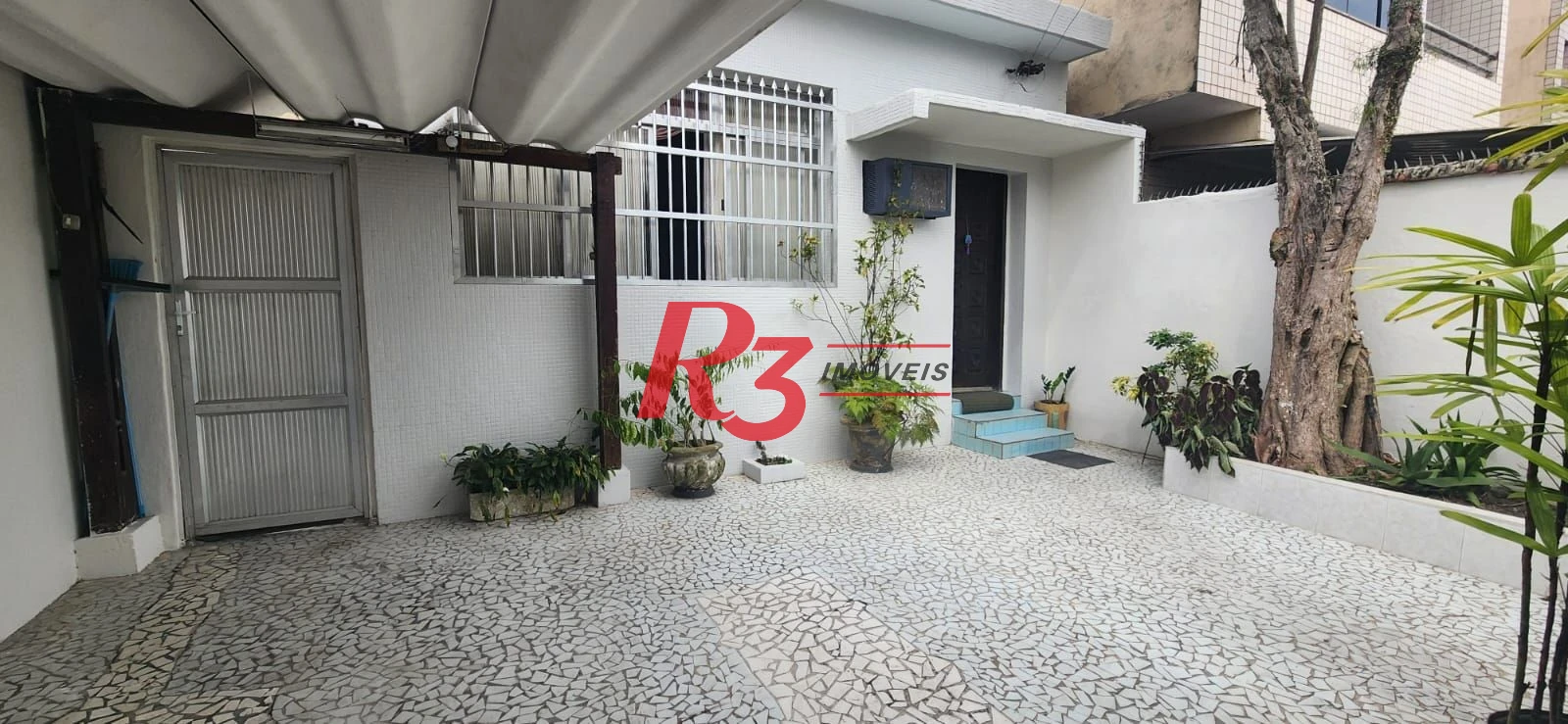 Casa com 3 dormitórios à venda, 117 m² por R$ 790.000,00 - Aparecida - Santos/SP