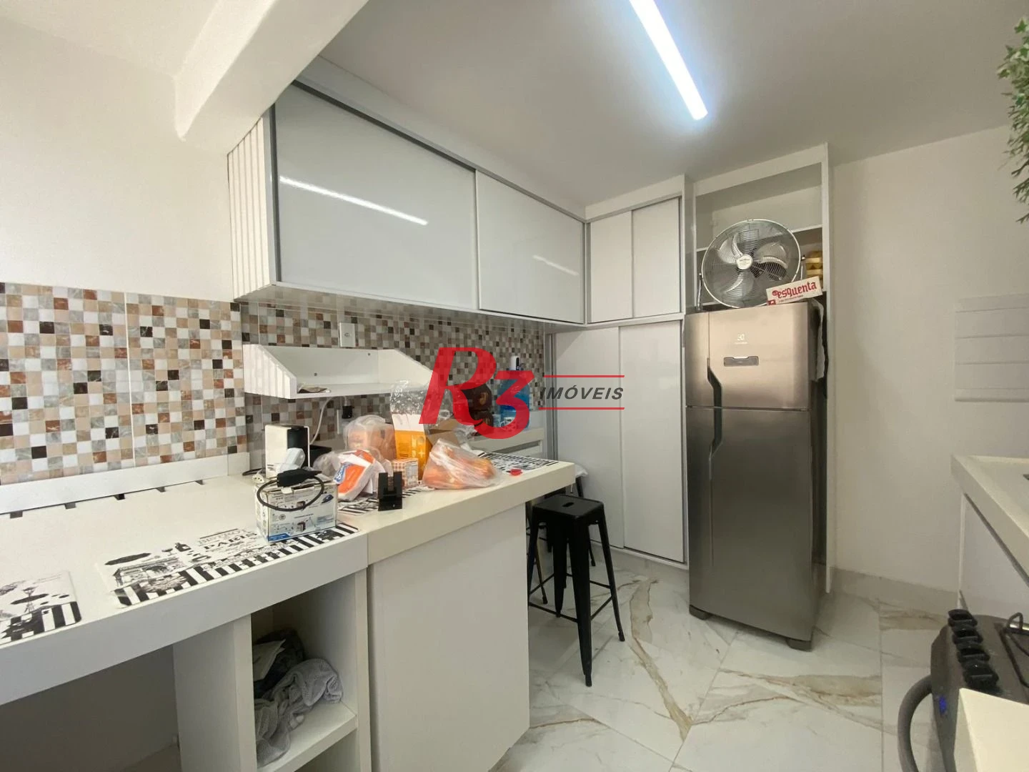 Apartamento com 2 dormitórios à venda, 59 m² por R$ 648.000,00 - Gonzaga - Santos/SP