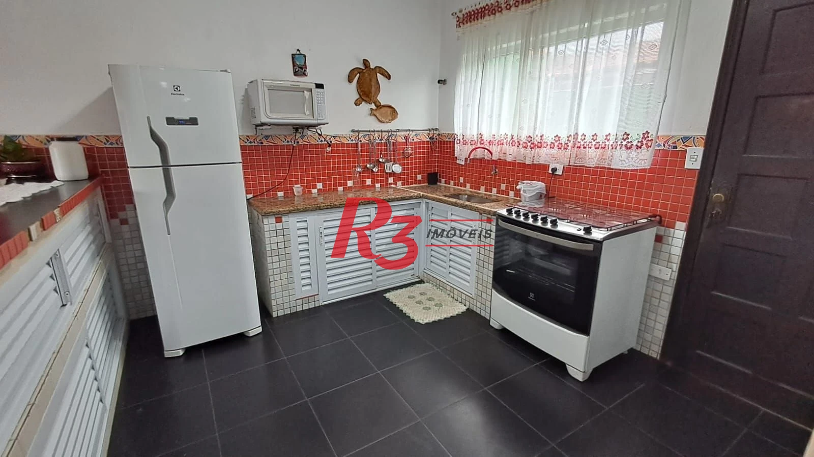 Sobrado com 4 dormitórios à venda, 268 m² por R$ 1.200.000,00 - Solemar - Praia Grande/SP
