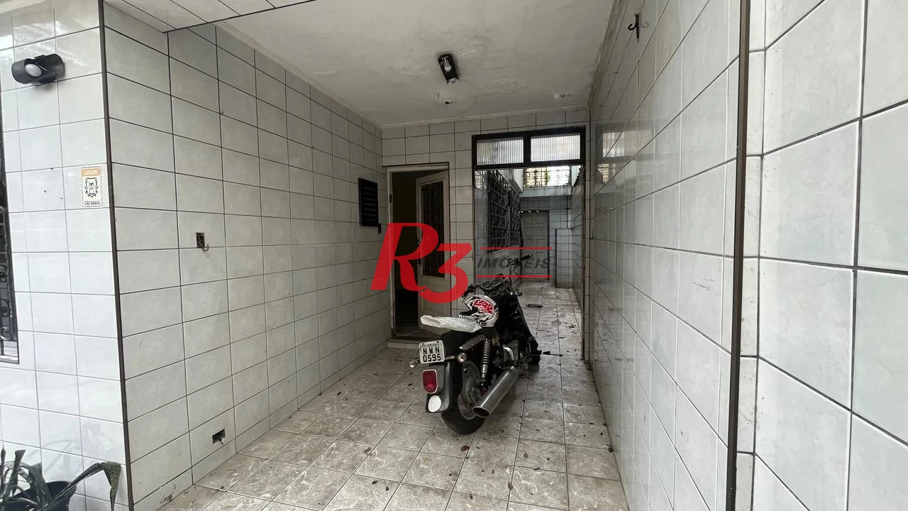 Sobrado com 3 dormitórios à venda, 107 m² por R$ 580.000,00 - Encruzilhada - Santos/SP