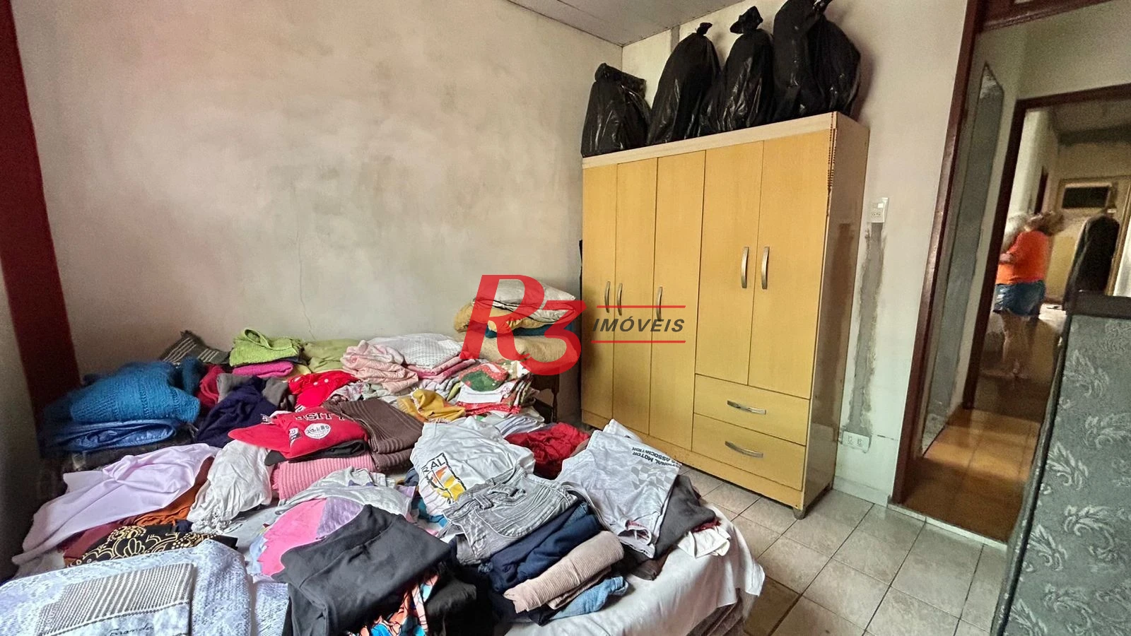 Sobrado com 3 dormitórios à venda, 121 m² por R$ 480.000,00 - Macuco - Santos/SP